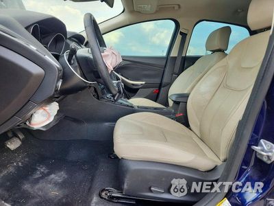 Zdjęcie 7 z 12 samochodu: 2016 FORD FOCUS TITANIUM VIN:1FADP3J24GL347652 - miniatura