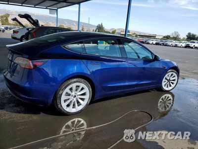Trzecie zdjęcie samochodu z tyłu: 2023 TESLA MODEL 3 VIN:5YJ3E1EA1PF447129 - miniatura