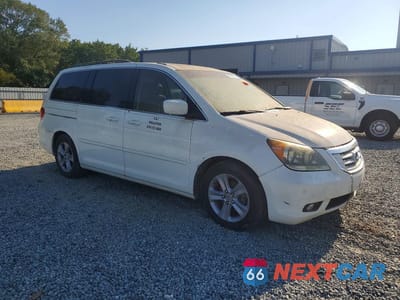 Czwarte zdjęcie samochodu z boku: 2010 HONDA ODYSSEY TOURING VIN:5FNRL3H90AB097478 - miniatura