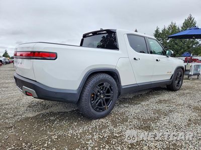 Trzecie zdjęcie samochodu z tyłu: 2023 RIVIAN R1T ADVENTURE VIN:7FCTGAAA9PN019398 - miniatura