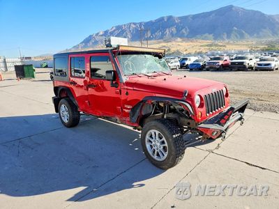 Czwarte zdjęcie samochodu z boku: 2011 JEEP WRANGLER UNLIMITED SAHARA VIN:1J4HA5H1XBL534497 - miniatura