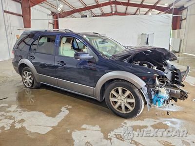 Czwarte zdjęcie samochodu z boku: 2009 FORD TAURUS X SEL VIN:1FMDK02W79GA03460 - miniatura