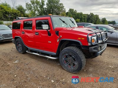 Czwarte zdjęcie samochodu z boku: 2004 HUMMER H2 VIN:5GRGN23U04H115455 - miniatura