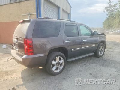 Trzecie zdjęcie samochodu z tyłu: 2011 CHEVROLET TAHOE K1500 LT VIN:1GNSKBE04BR106741 - miniatura