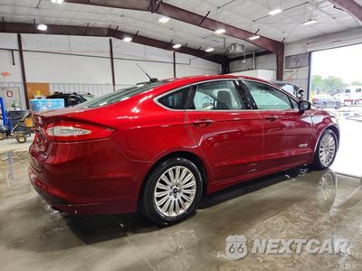 Trzecie zdjęcie samochodu z tyłu: 2013 FORD FUSION SE HYBRID VIN:3FA6P0LU3DR222791 - miniatura