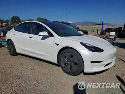 Czwarte zdjęcie samochodu z boku: 2023 TESLA MODEL 3 VIN:5YJ3E1EB2PF713184 - miniatura