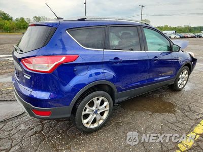 Trzecie zdjęcie samochodu z tyłu: 2014 FORD ESCAPE TITANIUM VIN:1FMCU0J93EUB14410 - miniatura