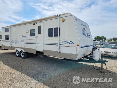 2004 KEYSTONE KEYSTONE 4YDT3012X4B040064 - główne zdjęcie licytacji z USA - miniatura