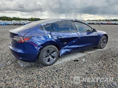 Trzecie zdjęcie samochodu z tyłu: 2023 TESLA MODEL 3 VIN:5YJ3E1EA6PF554564 - miniatura
