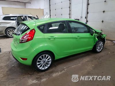 Trzecie zdjęcie samochodu z tyłu: 2014 FORD FIESTA SE VIN:3FADP4EJ2EM163054 - miniatura