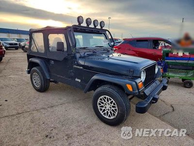 Czwarte zdjęcie samochodu z boku: 1999 JEEP WRANGLER / TJ SE VIN:1J4FY29P9XP434296 - miniatura