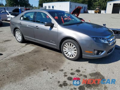 Czwarte zdjęcie samochodu z boku: 2010 FORD FUSION HYBRID VIN:3FADP0L32AR302240 - miniatura