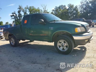 Czwarte zdjęcie samochodu z boku: 1999 FORD F150 VIN:1FTRX18L0XNC04513 - miniatura