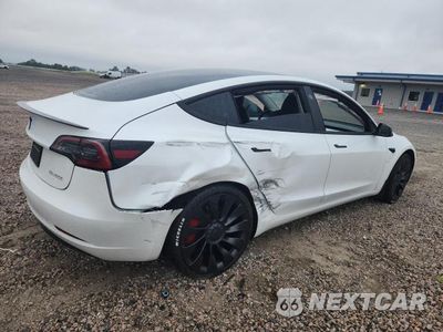 Trzecie zdjęcie samochodu z tyłu: 2023 TESLA MODEL 3 VIN:5YJ3E1EC4PF461852 - miniatura
