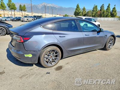Trzecie zdjęcie samochodu z tyłu: 2023 TESLA MODEL 3 VIN:5YJ3E1EA3PF418344 - miniatura