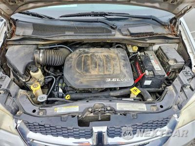Zdjęcie 12 z 13 samochodu: 2012 DODGE GRAND CARAVAN SXT VIN:2C4RDGCGXCR229017 - miniatura