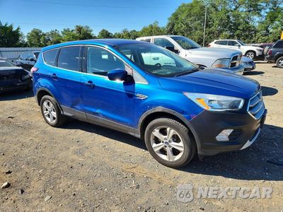 Czwarte zdjęcie samochodu z boku: 2017 FORD ESCAPE VIN:1FMCU9GDXHUE83270 - miniatura