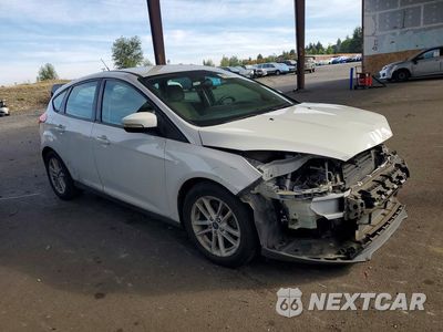 Czwarte zdjęcie samochodu z boku: 2017 FORD FOCUS SE VIN:1FADP3K22HL234556 - miniatura