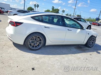 Trzecie zdjęcie samochodu z tyłu: 2023 TESLA MODEL 3 VIN:5YJ3E1EA7PF583054 - miniatura