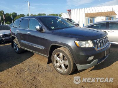 Czwarte zdjęcie samochodu z boku: 2013 JEEP GRAND CHEROKEE OVERLAND VIN:1C4RJFCG9DC639207 - miniatura