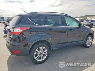 Trzecie zdjęcie samochodu z tyłu: 2018 FORD ESCAPE SE VIN:1FMCU9GDXJUC57963 - miniatura