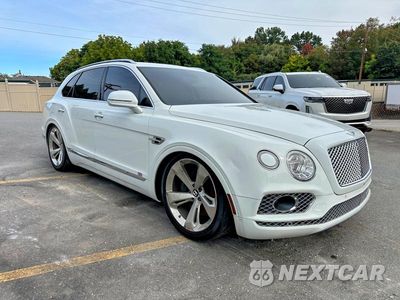 Czwarte zdjęcie samochodu z boku: 2017 BENTLEY BENTAYGA VIN:SJAAC2ZV0HC015180 - miniatura