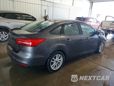 Trzecie zdjęcie samochodu z tyłu: 2017 FORD FOCUS SE VIN:1FADP3F24HL218952 - miniatura