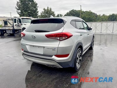 Trzecie zdjęcie samochodu z tyłu: 2018 HYUNDAI TUCSON LIMITED VIN:KM8J3CA29JU683318 - miniatura