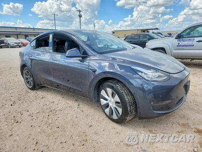 Czwarte zdjęcie samochodu z boku: 2022 TESLA MODEL Y VIN:7SAYGAEE4NF398740 - miniatura