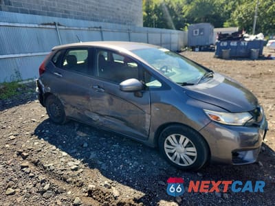 Czwarte zdjęcie samochodu z boku: 2017 HONDA FIT LX VIN:JHMGK5H56HS011041 - miniatura