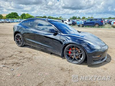 Czwarte zdjęcie samochodu z boku: 2022 TESLA MODEL 3 VIN:5YJ3E1EC0NF103919 - miniatura
