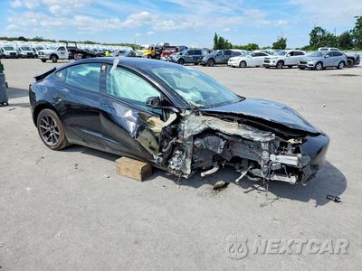 Czwarte zdjęcie samochodu z boku: 2023 TESLA MODEL 3 VIN:5YJ3E1EA3PF702945 - miniatura