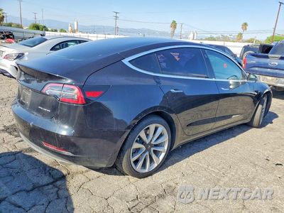 Trzecie zdjęcie samochodu z tyłu: 2018 TESLA MODEL 3 VIN:5YJ3E1EB1JF071662 - miniatura