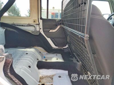 Zdjęcie 11 z 13 samochodu: 2014 JEEP WRANGLER UNLIMITED SAHARA VIN:1C4BJWEG0EL206987 - miniatura