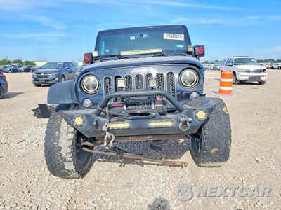 Piąte zdjęcie samochodu w środku: 2015 JEEP WRANGLER UNLIMITED SPORT VIN:1C4BJWDG3FL743694 - miniatura
