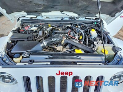 Zdjęcie 12 z 13 samochodu: 2011 JEEP WRANGLER UNLIMITED SAHARA VIN:1J4BA5H19BL563480 - miniatura