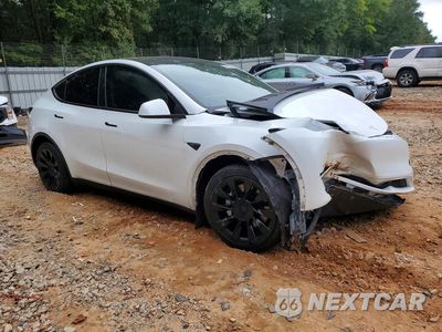 Czwarte zdjęcie samochodu z boku: 2023 TESLA MODEL Y VIN:7SAYGDEE5PA121029 - miniatura