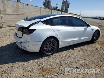 Trzecie zdjęcie samochodu z tyłu: 2021 TESLA MODEL 3 VIN:5YJ3E1EB4MF872591 - miniatura