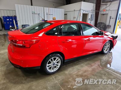 Trzecie zdjęcie samochodu z tyłu: 2016 FORD FOCUS SE VIN:1FADP3F29GL279843 - miniatura
