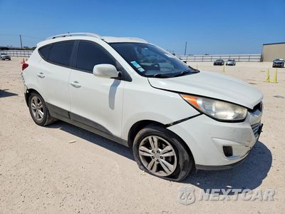 Czwarte zdjęcie samochodu z boku: 2010 HYUNDAI TUCSON GLS VIN:KM8JU3AC9AU017792 - miniatura