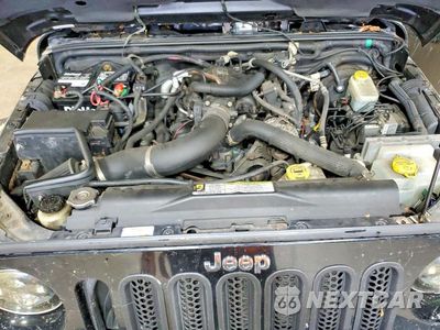 Zdjęcie 11 z 12 samochodu: 2007 JEEP WRANGLER SAHARA VIN:1J8GA59107L225704 - miniatura