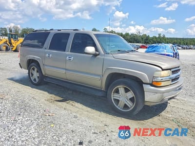 Czwarte zdjęcie samochodu z boku: 2001 CHEVROLET SUBURBAN K1500 VIN:1GNFK16T31J229268 - miniatura