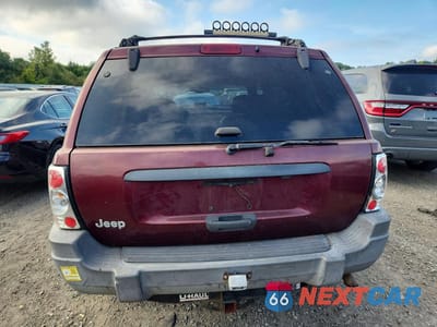 Zdjęcie 6 z 13 samochodu: 1999 JEEP GRAND CHEROKEE LAREDO VIN:1J4GW58S7XC678876 - miniatura