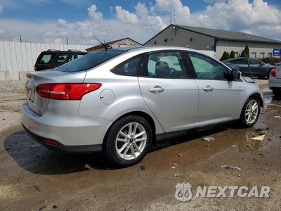 Trzecie zdjęcie samochodu z tyłu: 2016 FORD FOCUS SE VIN:1FADP3F29GL255753 - miniatura