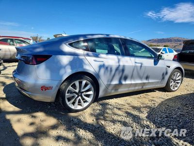 Trzecie zdjęcie samochodu z tyłu: 2018 TESLA MODEL 3 VIN:5YJ3E1EAXJF048551 - miniatura