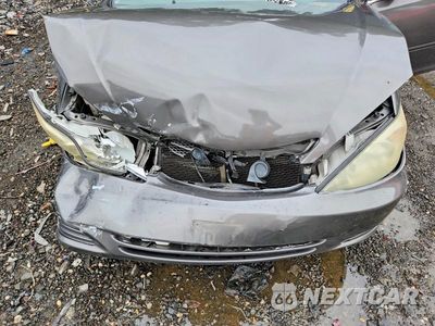 Zdjęcie 11 z 12 samochodu: 2004 TOYOTA CAMRY LE VIN:4T1BE32KX4U858516 - miniatura