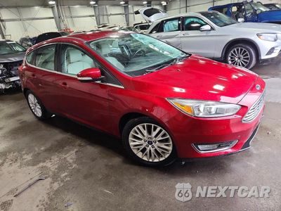 Czwarte zdjęcie samochodu z boku: 2015 FORD FOCUS TITANIUM VIN:1FADP3N20FL334406 - miniatura