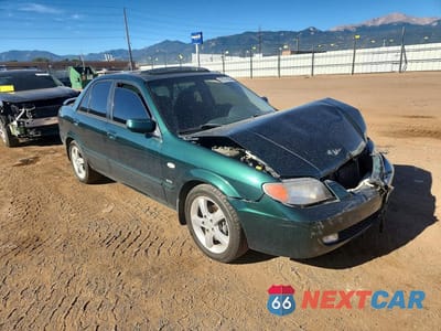 Czwarte zdjęcie samochodu z boku: 2002 MAZDA PROTEGE DX VIN:JM1BJ226021617642 - miniatura