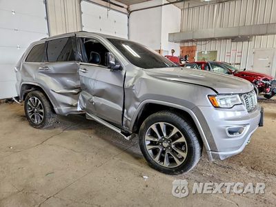 Czwarte zdjęcie samochodu z boku: 2017 JEEP GRAND CHEROKEE OVERLAND VIN:1C4RJFCT1HC761708 - miniatura