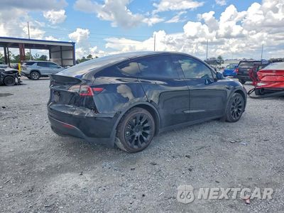 Trzecie zdjęcie samochodu z tyłu: 2021 TESLA MODEL Y VIN:5YJYGDEE4MF174364 - miniatura
